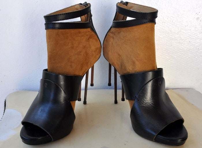 Acne Studios’ avant-garde “Rusty Nail” heels feature detachable spike stilettos and a striking mix of tan suede and black leather for an industrial, sculptural finish