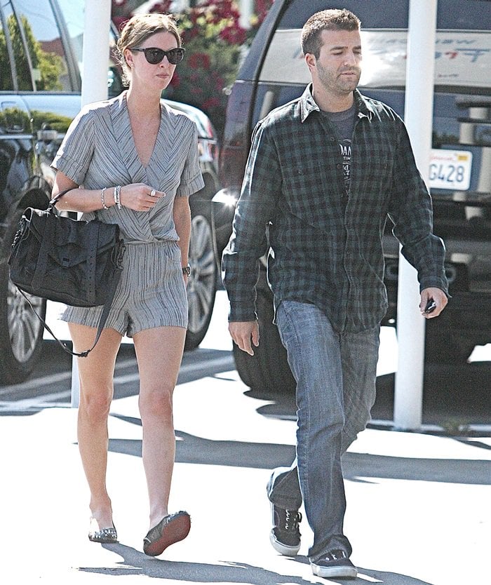 Nicky Hilton kept her off-duty style effortlessly polished while shopping at Saks Fifth Avenue in Beverly Hills on April 8, 2010, pairing a striped romper with black Repetto BB flats, a black Proenza Schouler PS1 bag, and Dsquared aviator sunglasses as she strolled alongside then-boyfriend David Katzenberg