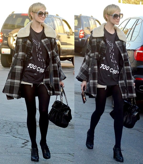 Ashlee Simpson defies winter norms in LA, styling denim cut-off shorts with sheer black tights, lace-up oxfords, and a cozy plaid wool coat for a chic, edgy twist