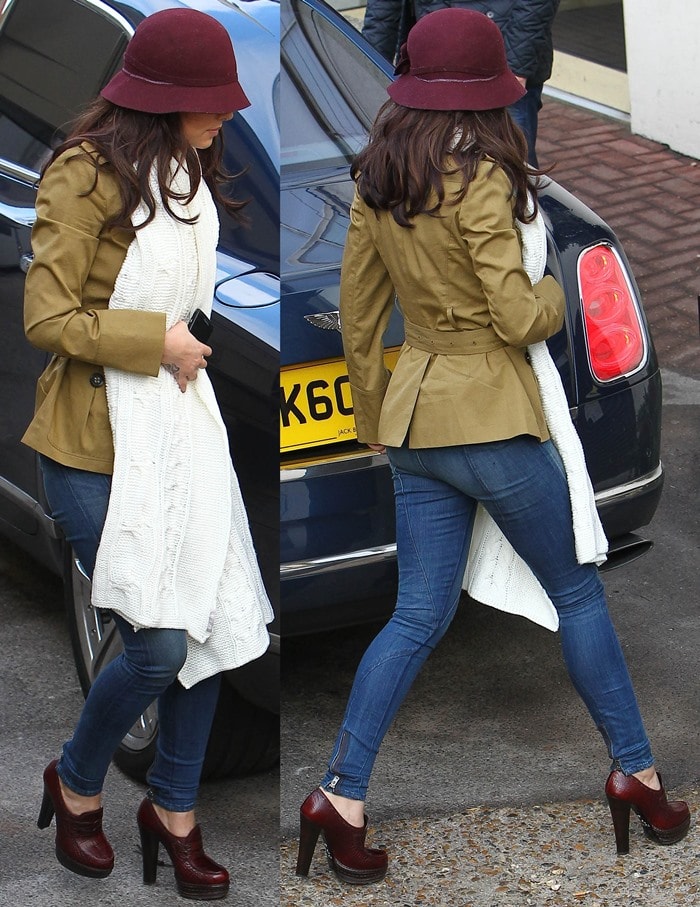 Cheryl Cole tops her dark brown tresses with a burgundy felt hat that matches her Prada loafer pumps
