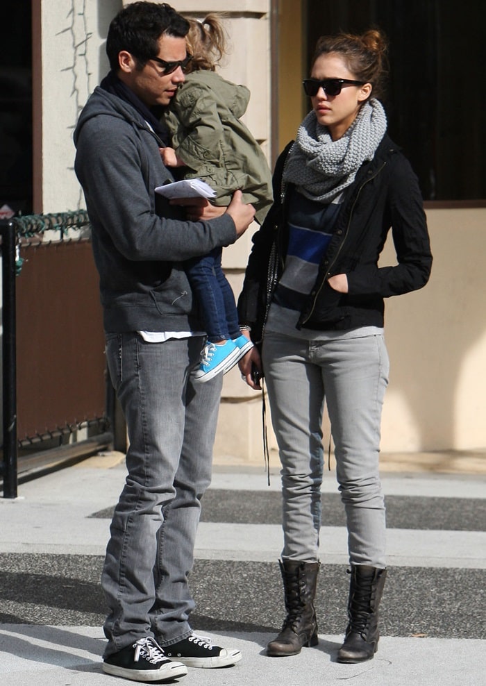 Jessica Alba keeps it casual yet chic in lace-up combat boots, skinny jeans, and a chunky knit scarf while enjoying a family day out in Beverly Hills with Cash Warren and daughter Honor Marie on November 27, 2010