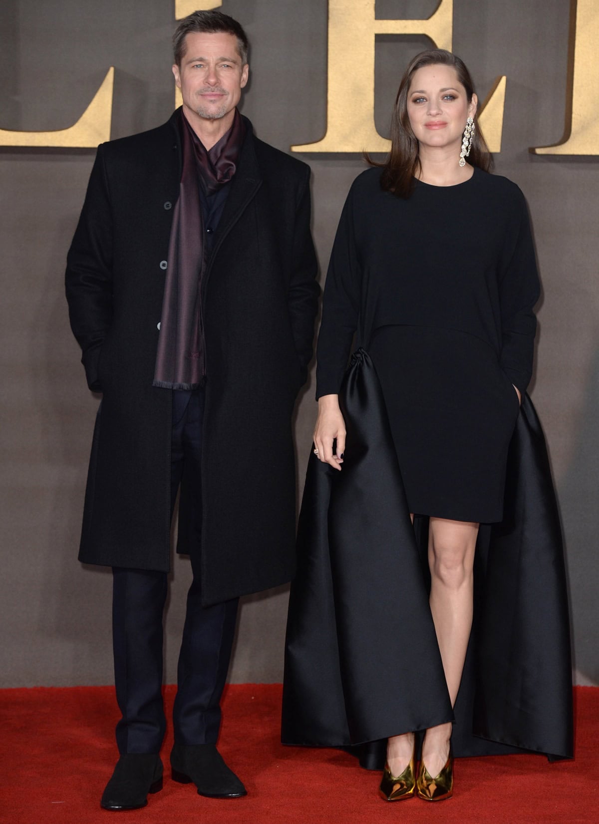 Brad Pitt kept it sleek at the Allied London premiere in Jimmy Choo Holden Dry Suede Boots in Ebony, while Marion Cotillard stunned in a custom Stella McCartney dress, bag, and shoes, paired with dazzling Chopard jewelry