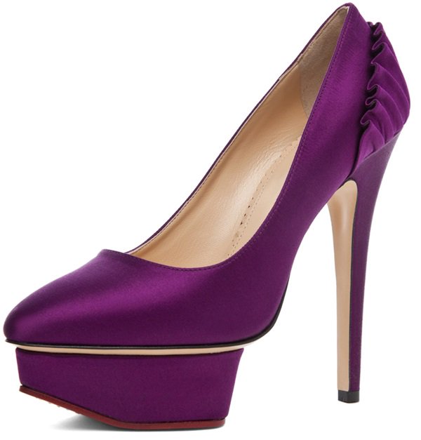 The Charlotte Olympia Paloma Signature Court Island platform in rich purple satin delivers dramatic height with a sculptural platform and a sleek, timeless silhouette