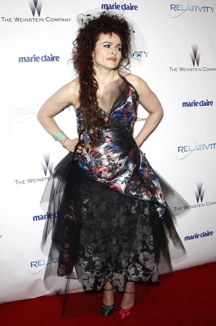 The English actress wore her mismatched shoes with a Vivienne Westwood metallic satin and tulle gown