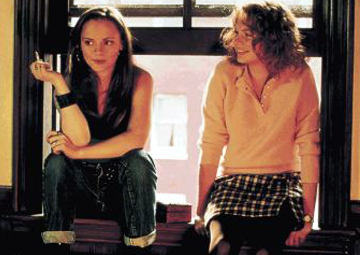 Christina Ricci and Michelle Williams, both 20, share a candid moment on the set of Prozac Nation—Ricci in edgy cuffed jeans and a leather cuff, Williams in preppy plaid and pastels