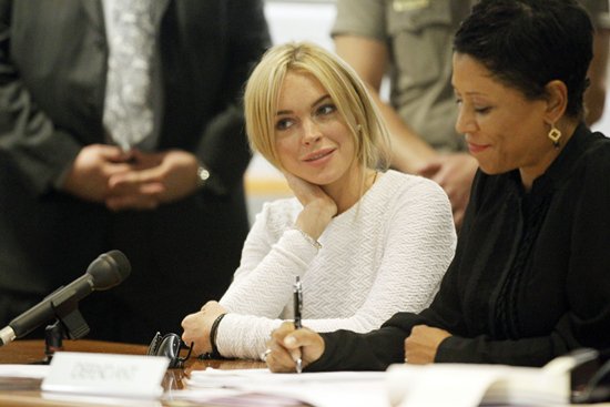 Charged with a felony count of grand theft for allegedly stealing a $2,500 necklace from a jewelry store in Venice, Lindsay Lohan appears at the Airport Courthouse