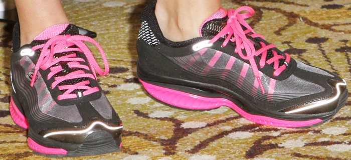 Kim Kardashian striking a pose in Skechers trainers, embodying the active lifestyle promoted by Shape-Ups