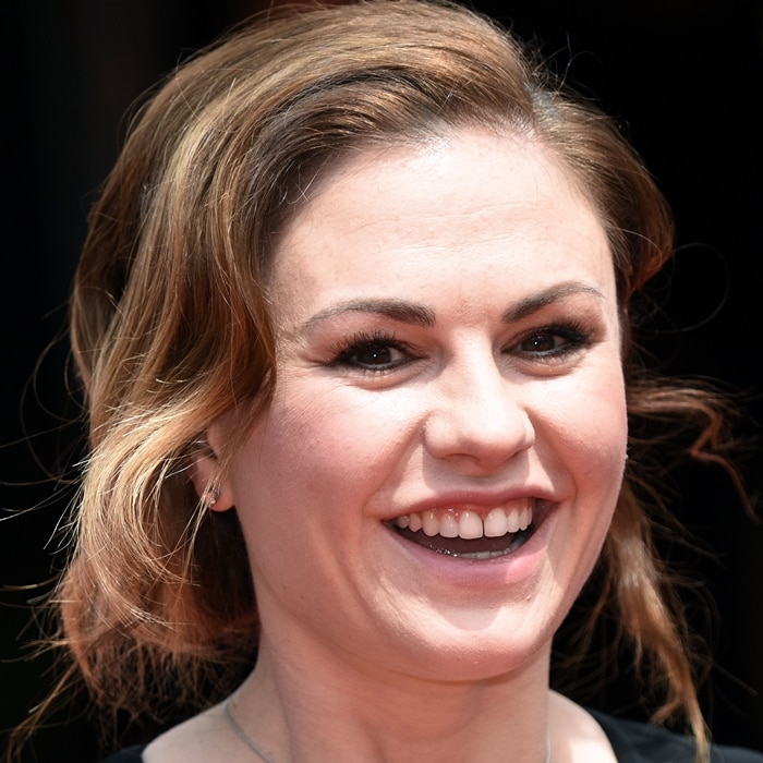 Anna Paquin flashed her trademark smile at the premiere of The Parting Glass during the 2018 Karlovy Vary International Film Festival in the Czech Republic on July 1, 2018, reaffirming her decision to embrace her natural teeth as part of her authentic red-carpet style