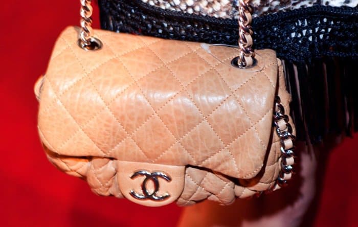 Accessorizing to perfection: Vanessa Hudgens pairs her Blu Moon outfit with a classic Chanel purse