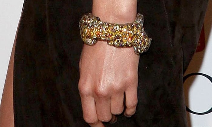 Karolina Kurkova adds a touch of glamour with a sparkling jeweled bracelet