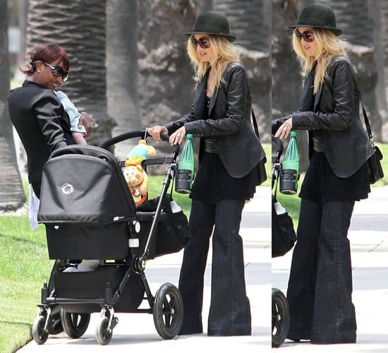 Rachel Zoe pushing a stroller as she walks with her nanny and infant son Rachel Zoe, balancing motherhood and fashion, strolls with her son Skyler in Beverly Hills, still favoring her J Brand maternity jeans, on May 23, 2011