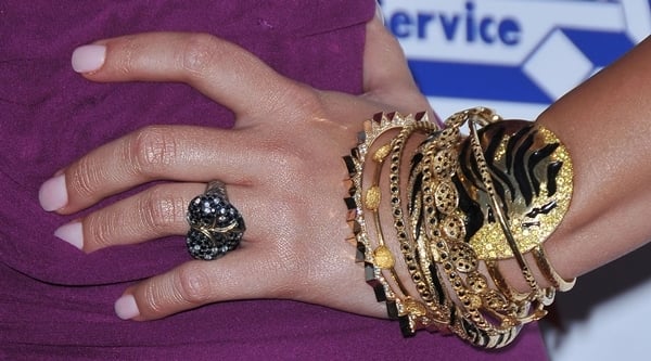 Demi Lovato accessorizes with a bold stack of gold bangles and a statement ring
