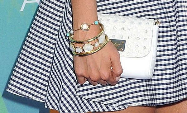 Exquisite Accessory: Nina Dobrev elegantly carries a quilted white DG clutch, a standout piece in her Teen Choice Awards outfit