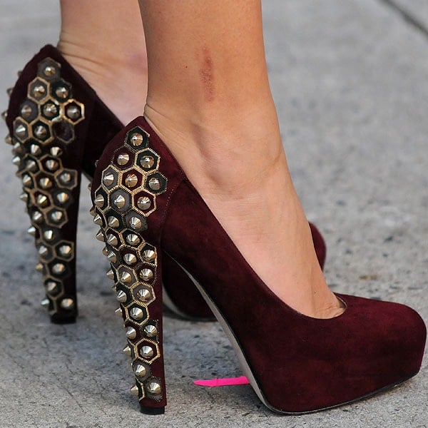 Blake Lively in Brian Atwood Power Studs A close-up of Blake Lively in 'Power Studs' by Brian Atwood, showcasing the luxe suede and daring studs that redefine footwear elegance