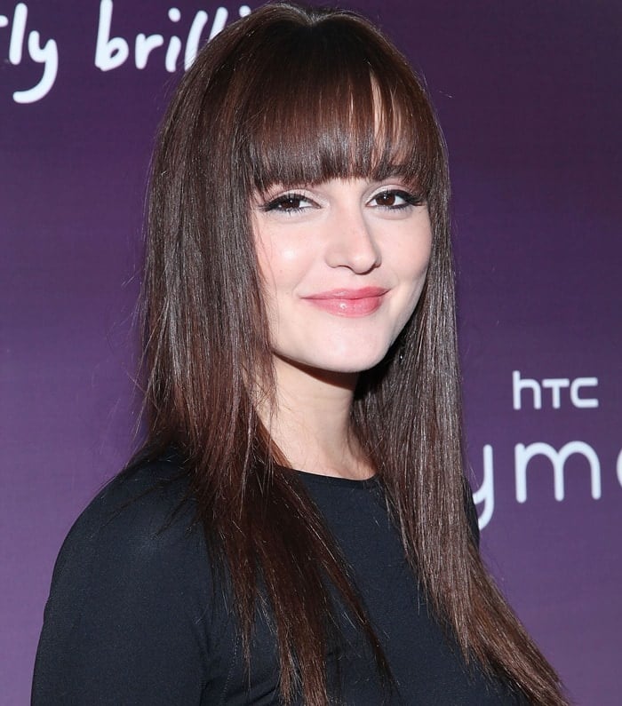 Leighton Meester stuns with sleek, straight hair and full fringe, complemented by soft pink makeup at the HTC Serves Up NYC Product Launch event