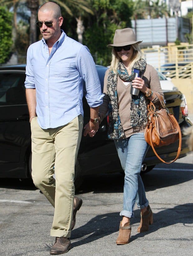 Reese Witherspoon, accompanied by her husband Jim Toth, was seen leaving church on September 18, 2011, stylishly dressed in Ray-Ban Original Wayfarer RB2140 sunglasses, a Rolex Day Date Presidential wristwatch, a Chloé Paraty python and leather bag, and Rag Bone Harrow leather ankle boots