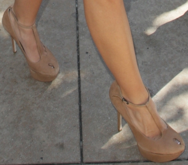 Ashley Tisdale effortlessly elevates her look in Sam Edelman’s chic "Nivan" pumps, featuring a stylish peep-toe design and sky-high stiletto heels