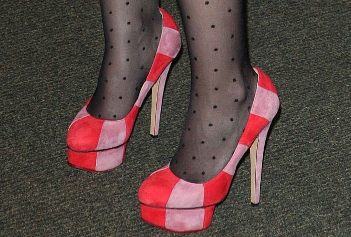 Hilary Duff added a playful edge to her look in Charlotte Olympia’s red-and-pink striped ‘Priscilla’ platform pumps, styled with sheer polka-dot tights for a whimsical finish