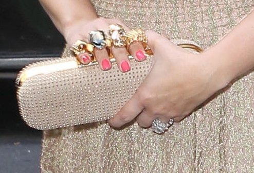 Kim Kardashian arriving at a Manhattan Hotel with Knuckle Clutch Kim Kardashian carries an Alexander McQueen knuckle duster studded suede clutch
