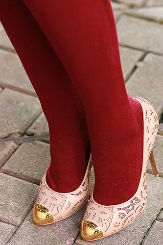 Mayo Wo and her Giuseppe Zanotti metal toecap laser cut pumps Mayo Wo highlights her Giuseppe Zanotti laser-cut pumps with gold toe caps, styled playfully with bold red socks