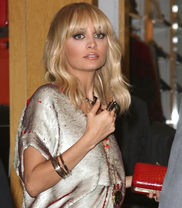 Nicole Richie attended the unveiling of her House of Harlow 1960 holiday pop-up shop at Fred Segal in West Hollywood on Saturday, November 19, looking festive in a Halston dress and House of Harlow 1960 accessories