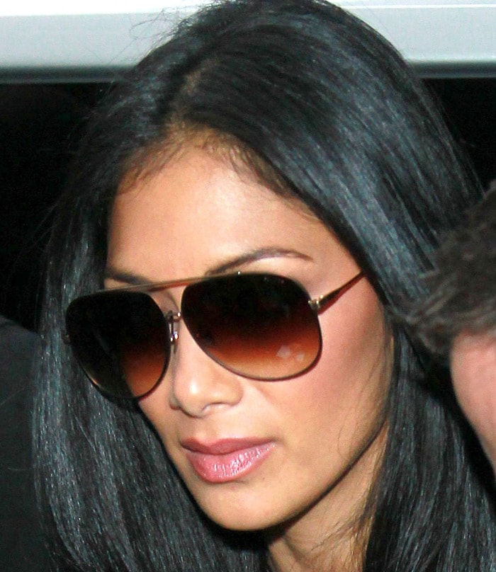 A closer look at Nicole Scherzinger’s sleek makeup and oversized gradient sunglasses completing her futuristic ensemble