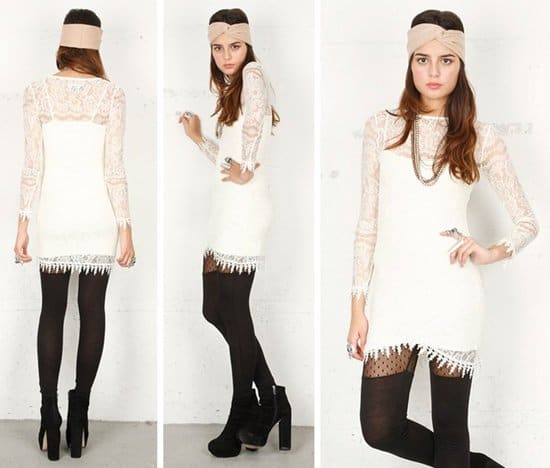 For Love Lemons “Scarlet” dress in white, a lace-forward mini defined by sheer long sleeves, crochet-trimmed cuffs, and a delicately fringed hem—an airy, romantic silhouette that sits firmly in the contemporary sweet spot between high-street ease and elevated design