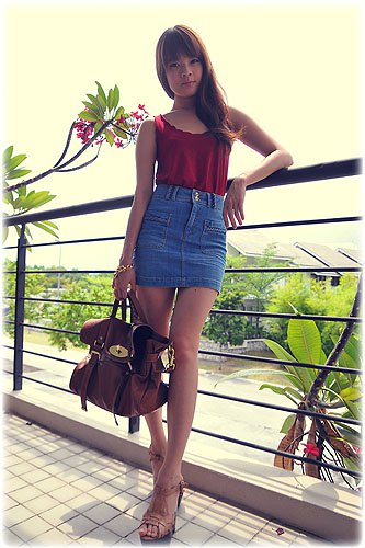 Bobo Stephanie denim outfit City-chic perfection: Bobo stuns in a high-waisted denim skirt and strappy nude heels, blending effortless elegance with laid-back urban charm