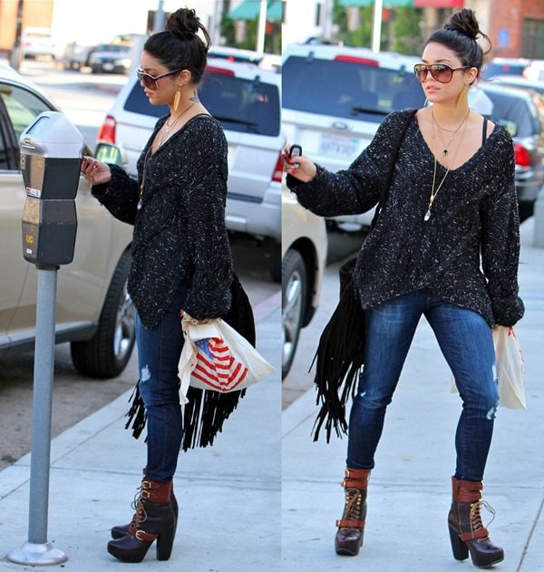 Vanessa Hudgens steps out in Beverly Hills on December 21, 2011, wearing a Silence Noise slouchy sweater, Siwy Denim Hannah jeans, Free People Miista 'Andee' platform buckle boots, and accessorizing with a fringed Ember Skye handbag, Natalie B necklace, and Marc Jacobs sunglasses