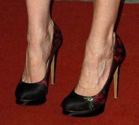 Kirsten Dunst at the Women In Entertainment Breakfast Kirsten Dunst showcases her feet in Nicholas Kirkwood's floral print satin pumps featuring a striking blend of elegance and bold design