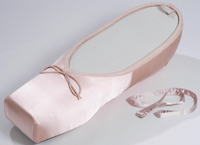 The firm of Vic Fearn and Company in Nottingham creates bespoke coffins, including this unique ballet shoe design, showcased in their "Crazy Coffins" exhibition in Germany