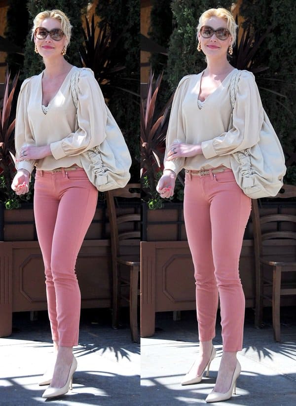 Katherine Heigl paired her rose-pink Henry Belle “Ideal” skinny jeans with cream pointed-toe pumps and a flowing chiffon blouse while arriving at Il Pastaio in Los Angeles on March 21, 2012, completing the softly tonal look with oversized sunglasses and a slouchy neutral shoulder bag