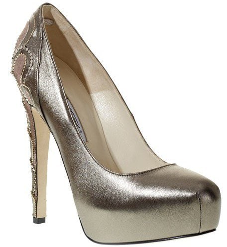 Brian Atwood Claudia Bis Pump The Brian Atwood ‘Claudia Bis’ pump features a striking metallic finish, sculpted platform sole, and an ornate heel embellished with beaded and embroidered detailing for a bold, luxurious statement