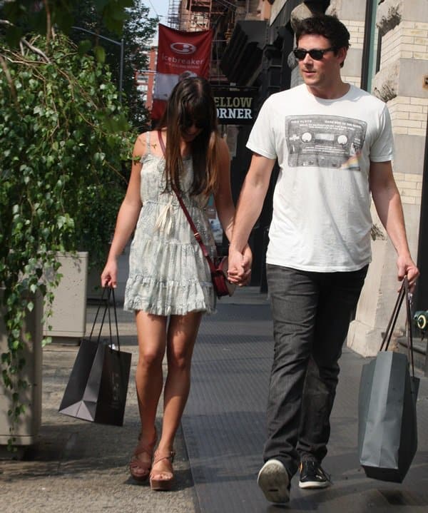 Lea Michele and Cory Monteith enjoy a sunny day out in New York City, with Lea looking effortlessly chic in a ruffled baby doll dress, platform sandals, and a crossbody bag—perfectly coordinating with Cory’s laid-back tee and jeans