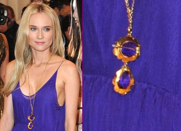 Diane Kruger Schiaparelli and Prada 'Impossible Conversations' Costume Institute Gala 2012 at The Metropolitan Museum of Art Diane Kruger wears a gold necklace with purple stones at the "Schiaparelli And Prada: Impossible Conversations" Costume Institute Gala