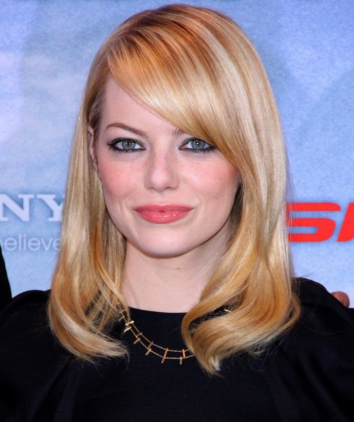 Emma Stone stuns in a chic all-black ensemble, highlighted by a sleek bob and a delicate gold necklace, at the Berlin photocall for The Amazing Spider-Man