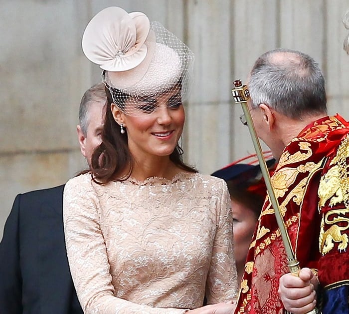 Catherine, Duchess of Cambridge, radiates elegance as she departs St. Paul's Cathedral in London on June 5, 2012, following a Service of Thanksgiving for the Queen's Diamond Jubilee, wearing a delicate lace Alexander McQueen dress and a Jane Taylor hat adorned with a birdcage veil