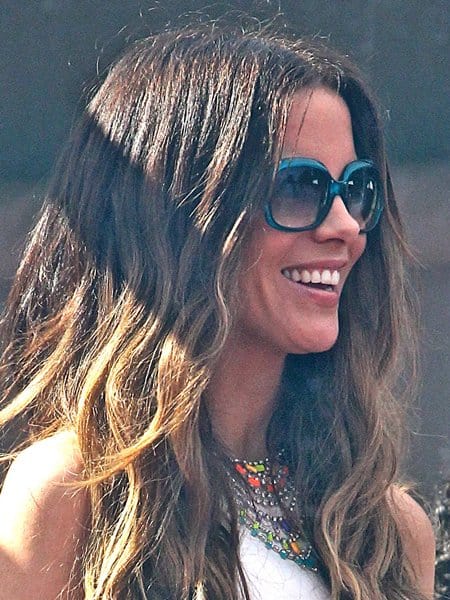 Kate Beckinsale in her Dazzling Colorful Necklace at Joel Silver's Memorial Day Party Kate Beckinsale enhances her summery outfit with a striking Tom Binns tiered multicolor necklace, adding a splash of color to her all-white ensemble