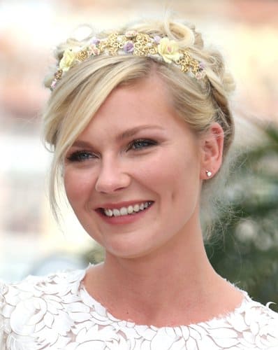 Kirsten Dunst at Cannes 2012 Kirsten Dunst in a white DG dress and bejeweled flower tiara at her Cannes Film Festival debut