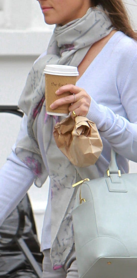 Pippa Middleton spotted with a coffee on the Kings Road in Chelsea Accentuating her monochrome ensemble, Pippa Middleton adds a touch of flair with her printed grey scarf, subtly highlighted with pops of magenta, creating a stylish statement on the streets of Chelsea