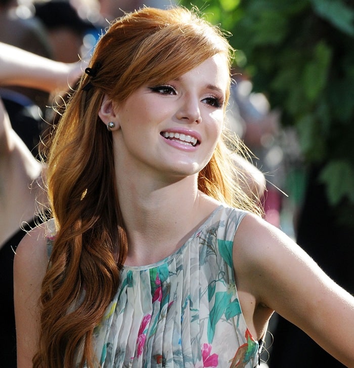 Bella Thorne’s soft, side-swept curls and glowing makeup with winged eyeliner and rosy lips perfectly highlight her youthful elegance and red carpet charm at the World Premiere of 'The Odd Life of Timothy Green' at El Capitan Theater in Los Angeles