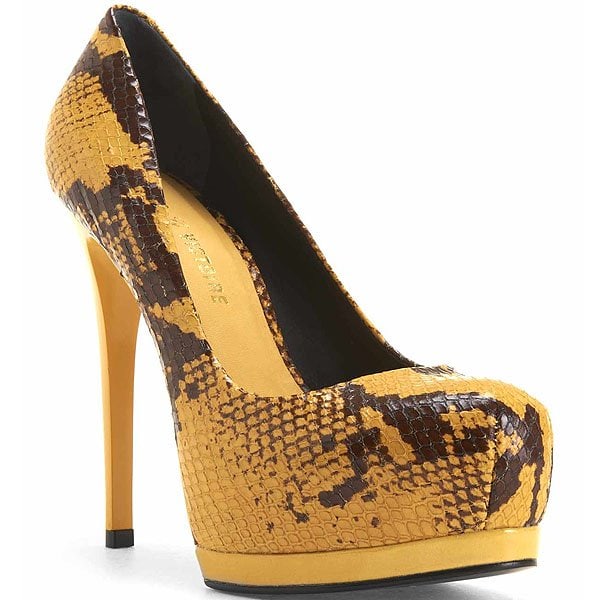 Pour La Victoire Zimmer Yellow snakeskin Pour La Victoire “Zimmer” platform pumps, defined by their sky-high stiletto heel, rounded toe, and bold contrast platform