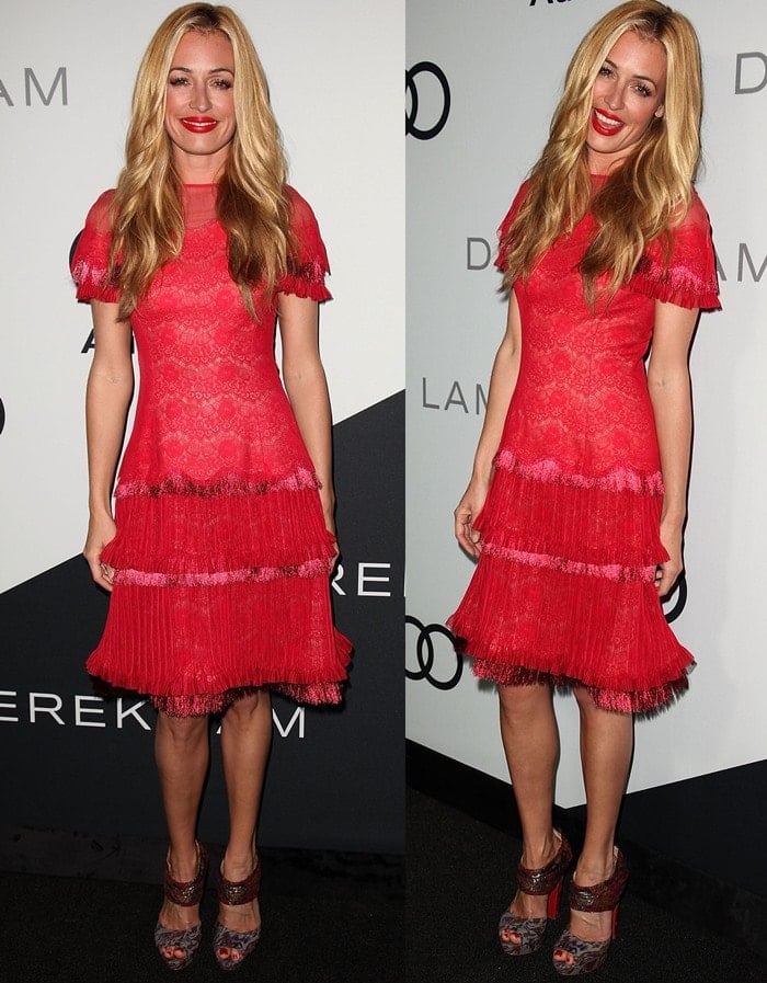 Cat Deeley radiates confidence in a vibrant red lace cocktail dress with tiered fringe details paired with printed platform heels