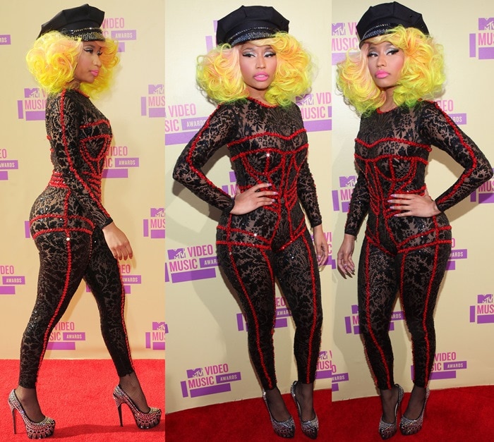 Nicki Minaj wearing a black lace Versace catsuit featuring ruby red jewel embellishments