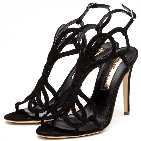 Rupert Sanderson Figaro, $855 Rupert Sanderson “Figaro” black suede stiletto sandals featuring elegant looping straps, a sculptural strappy silhouette, and a sleek high heel that balances delicacy with modern drama