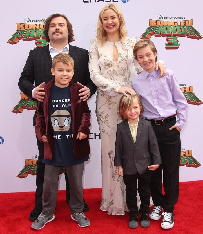 Kate Hudson attends the Kung Fu Panda 3 world premiere at the TCL Chinese Theatre on January 16, 2016, wearing a flowing Monique Lhuillier gown with mirrored Jimmy Choo platform peep-toe pumps, posing alongside co-star Jack Black and his son, as well as her sons Ryder Robinson and Bingham Hawn Bellamy