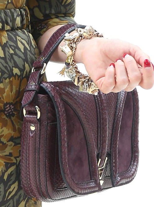 dita von teese bag Close-up of Dita von Teese's luxurious and exotic Bordeaux handbag, a statement piece that showcases her unique style, captured at London Fashion Week