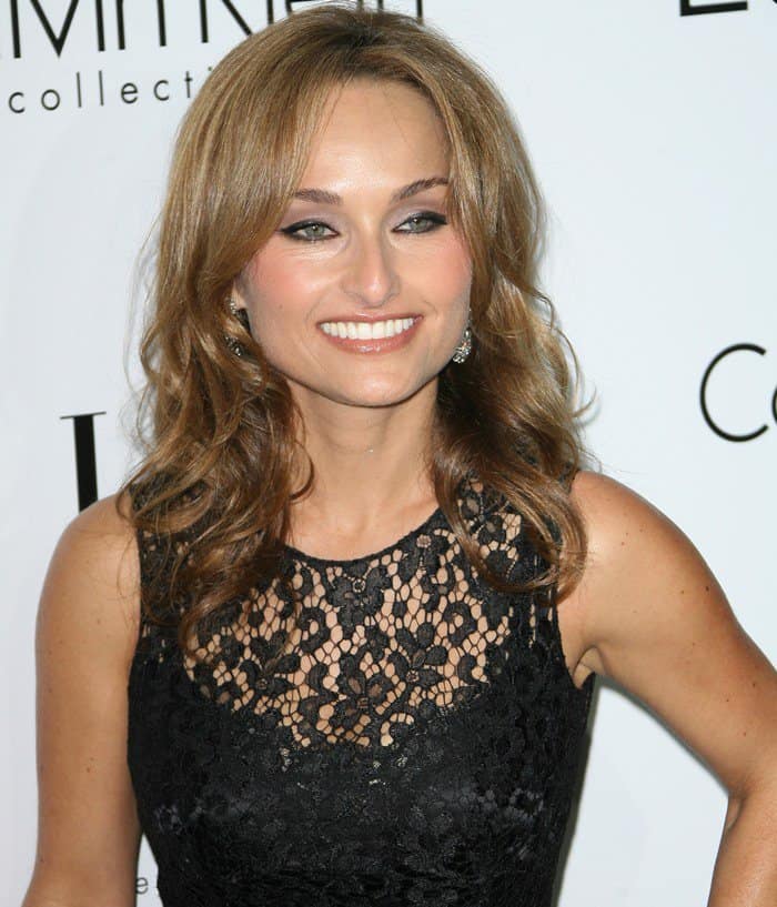 Giada De Laurentiis dazzles in a timeless black lace dress, radiating elegance with soft waves and a warm smile