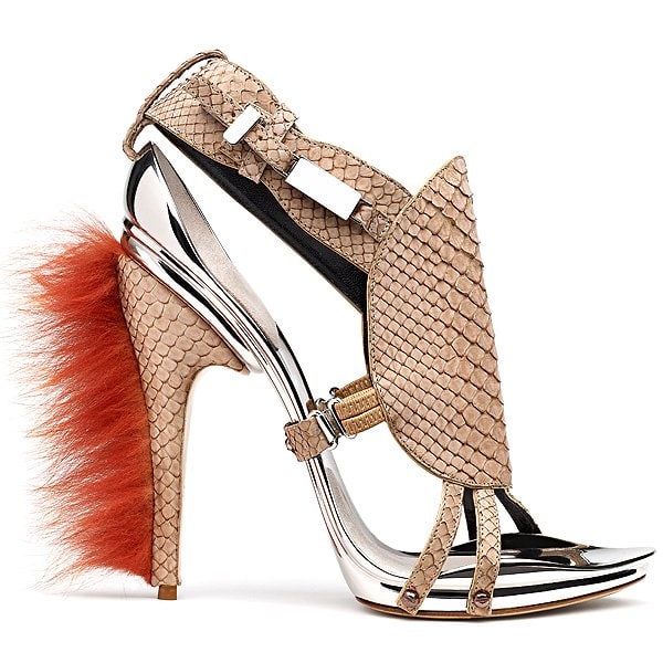 Gianluca Tamburini Kira Kira blends snakeskin-textured leather, chrome architectural framing, and a bold red fur heel—delivering a striking clash of natural texture and futuristic form