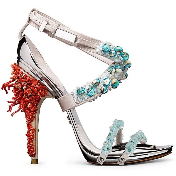 Gianluca Tamburini Tarita The Tarita sandal by Gianluca Tamburini evokes an oceanic fantasy with pale pink straps, turquoise and shell embellishments, and a coral-encrusted heel that mimics underwater textures